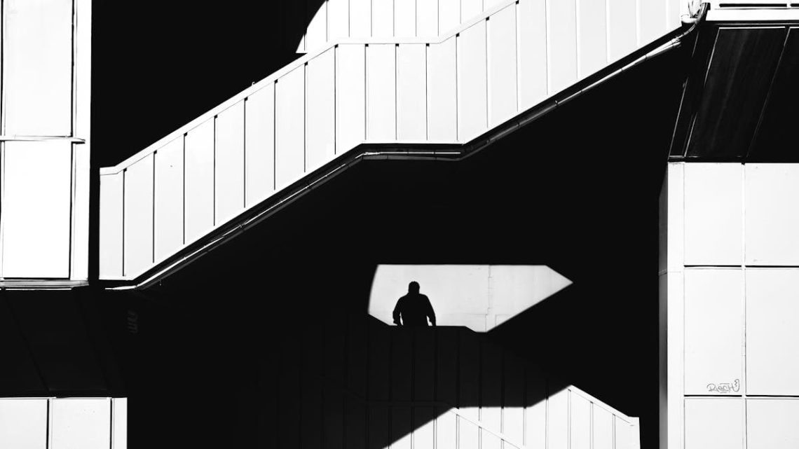 Black and white silhouette of a person on stairs in İstanbul, Türkiye capturing urban architecture.